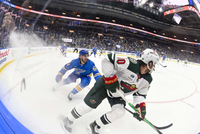 Mar 16, 2024; St. Louis, Missouri, USA; Minnesota Wild center Marcus Johansson (90) controls the puck as St. Louis Blues defenseman Matthew Kessel (51) defends during the first period at Enterprise Center.